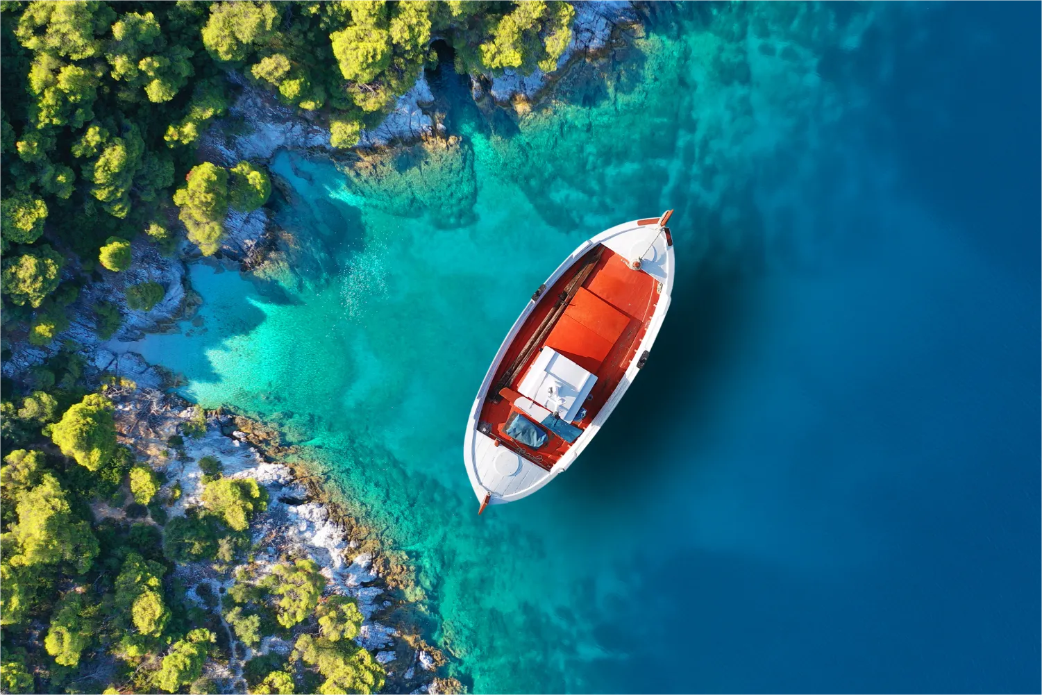 Aerial Photo Of Traditional Fishing Boat Anchored Near Small Picturesque Port Of Agnontas in Skopelos