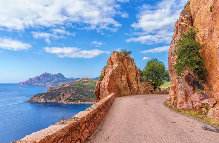 Colorful mountain road with sea view on one side, In Calanques De Piana in Corsica, France