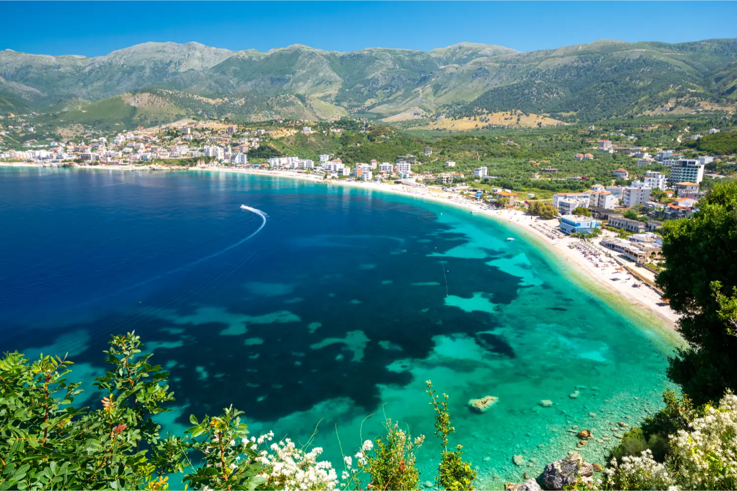 Drone view of a bay and coastal town in Albania