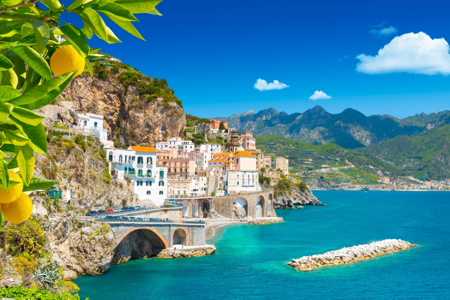 Beautiful View Of Amalfi On The Mediterranean Coast With Lemons In The Foreground