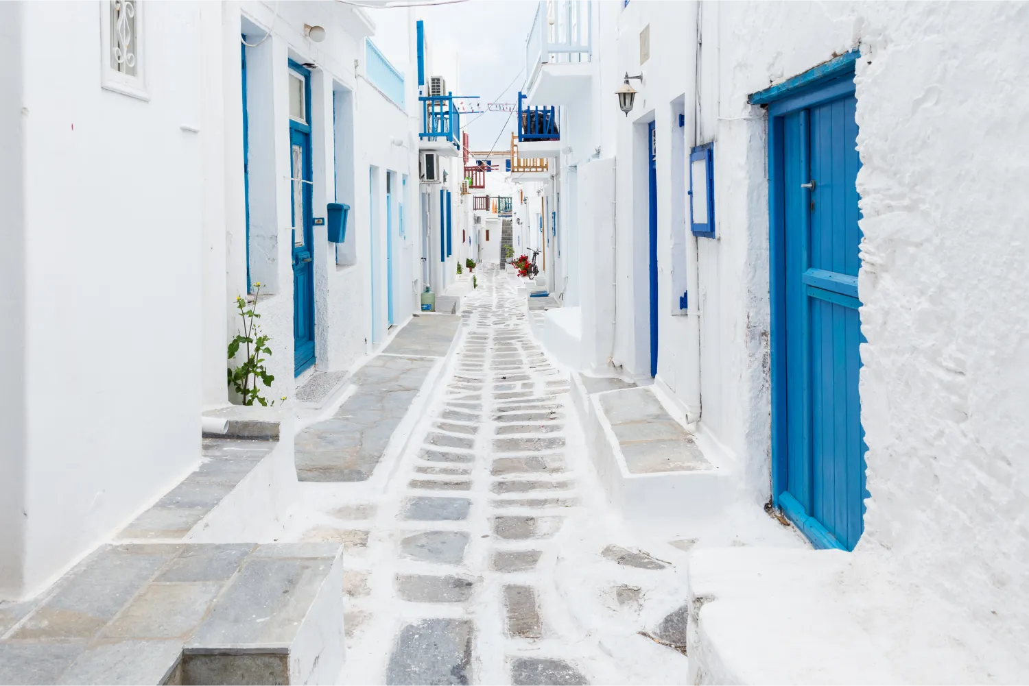 The whitewashed buildings and narrow streets in the town of Mykonos