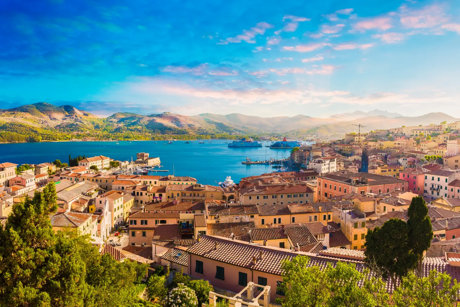 Sunset View Of Piombino Piazza Bovio Lighthouse And Elba Island in the background