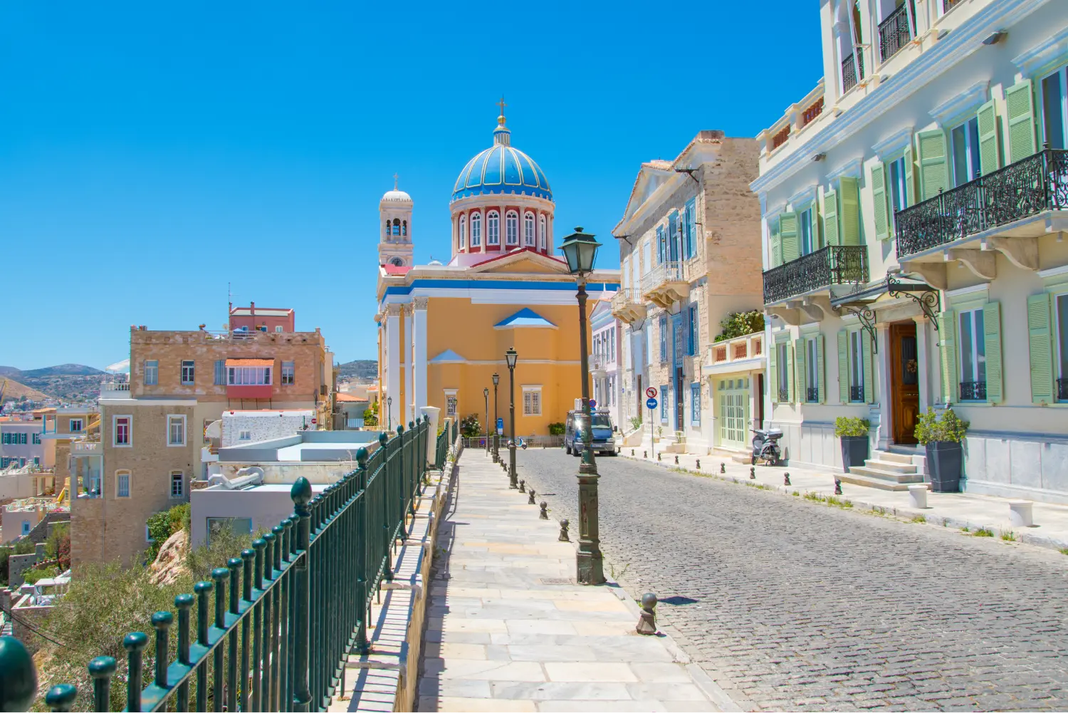 A paved street in Syros, leading to a church