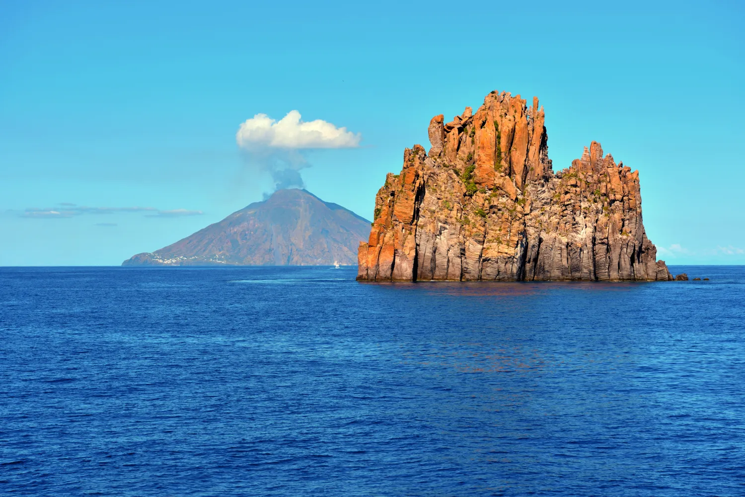 distant view of the island of Stromboli and the volcano in mount Stromboli