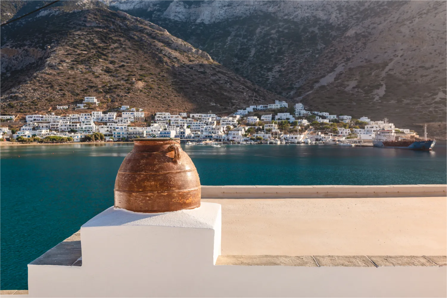Flower Pot On The Roof Of The House Overlooking The bay of Sifnos town