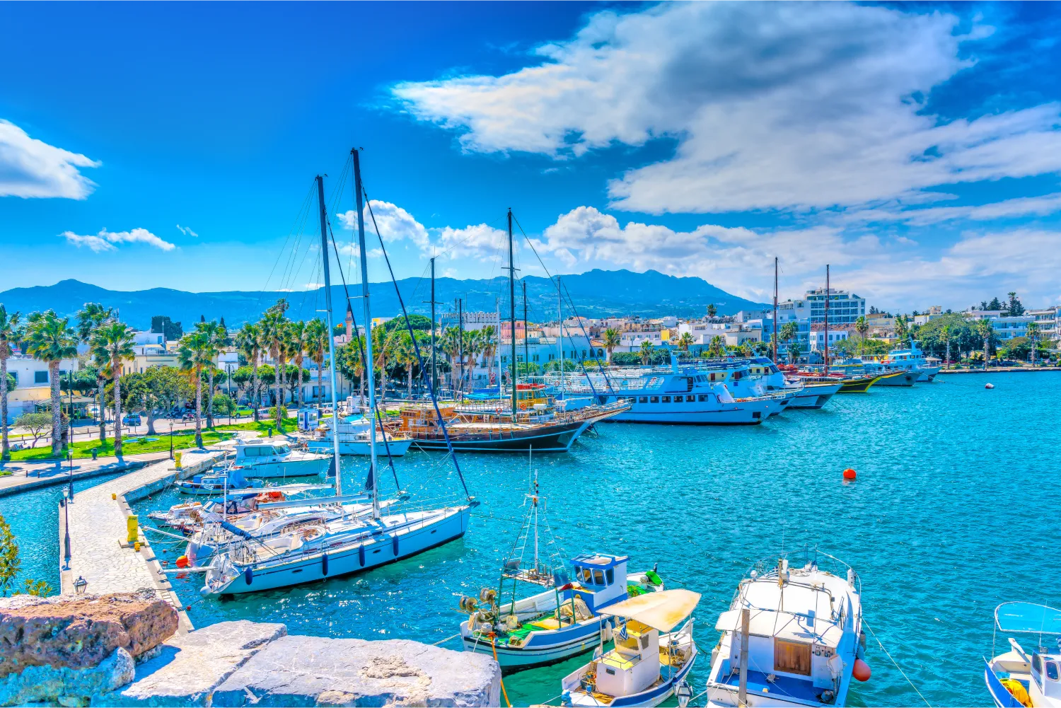 The Main Port Of Kos with a variety of boats