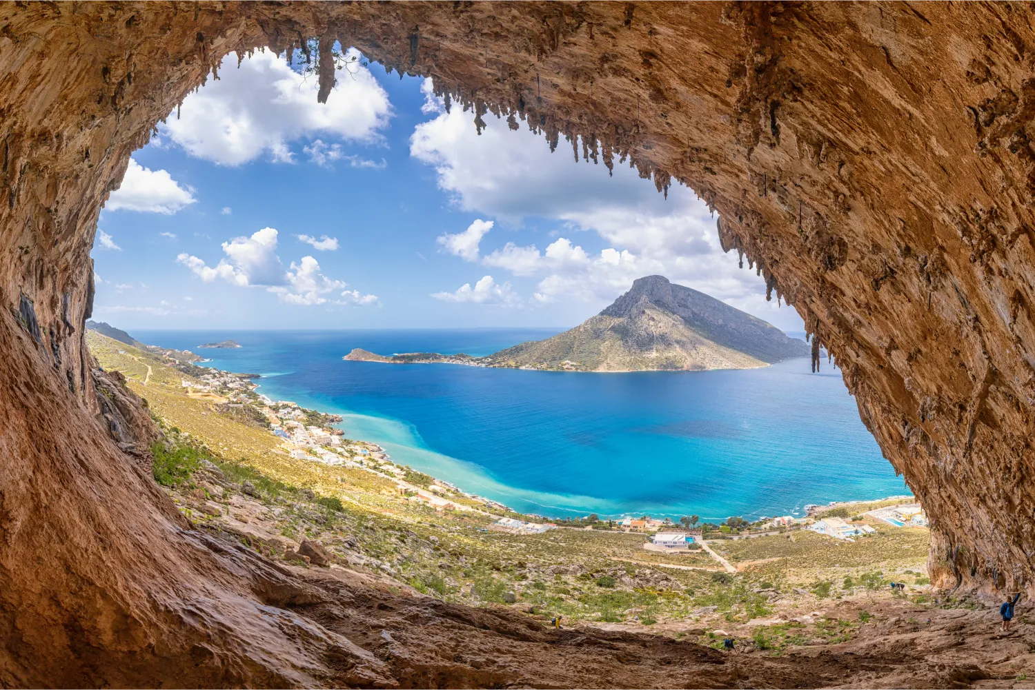 The Famous Grande Grotta Climbing Fields Of Kalymnos with Telendos in the background