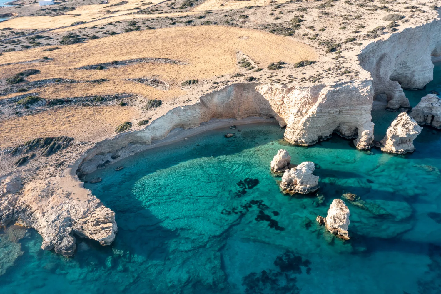 Aerial view of a Secluded turqouise beach in Koufonisia