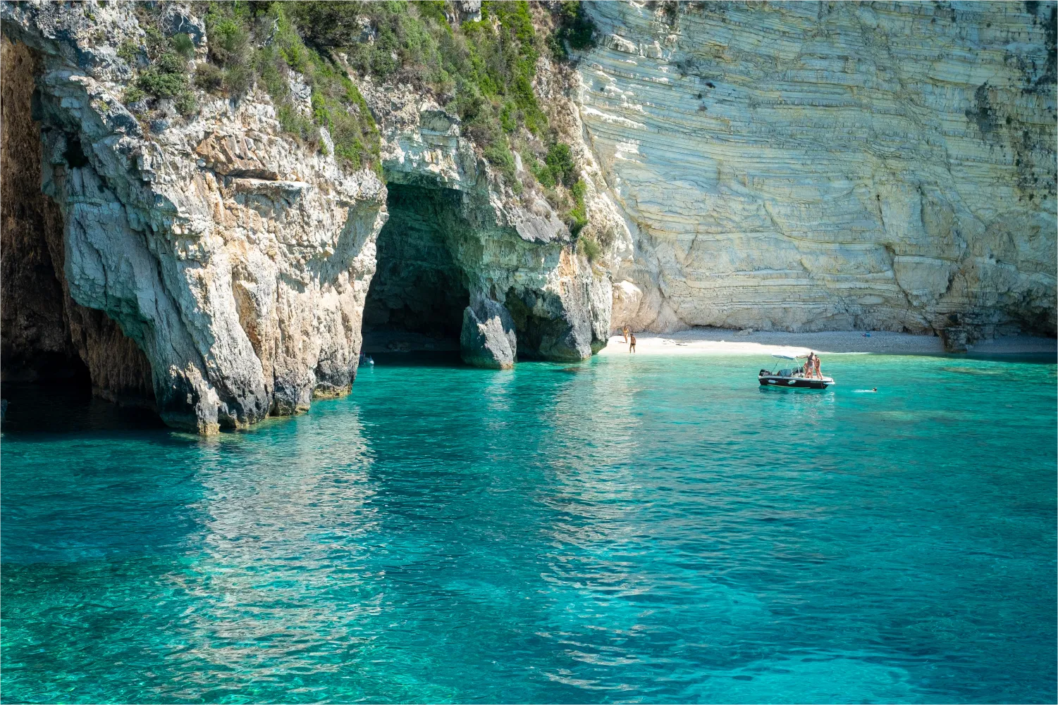 Three Exceptional Sea Caves Which Are Communicating Each Other in Paxos Island