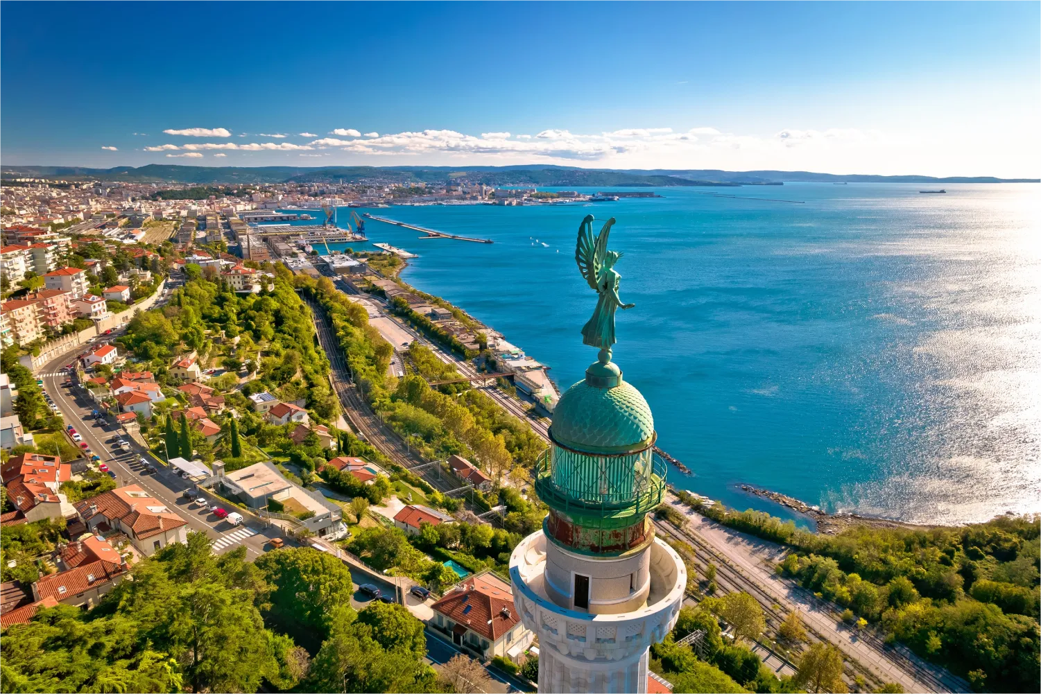 Aerial view of Lighthouse Phare De La Victoire and the city of Trieste in the background
