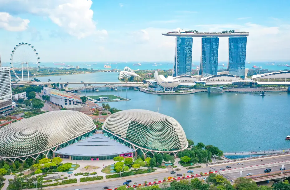 Panoramic view of Marina Bay Singapore featuring the Marina Bay Sands hotel, ArtScience Museum, Esplanade and HarbourFront.  Theatres on the Bay and the Singapore Flyer.