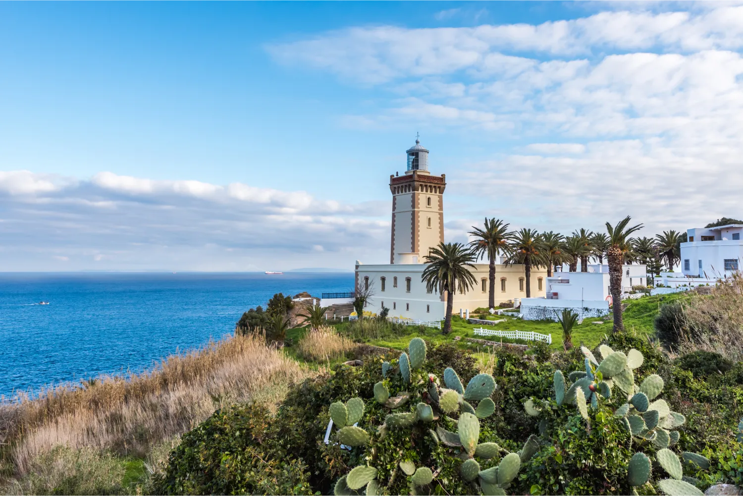 Lighthouse surrounded by pine trees At The Cape Spartel In Tanger