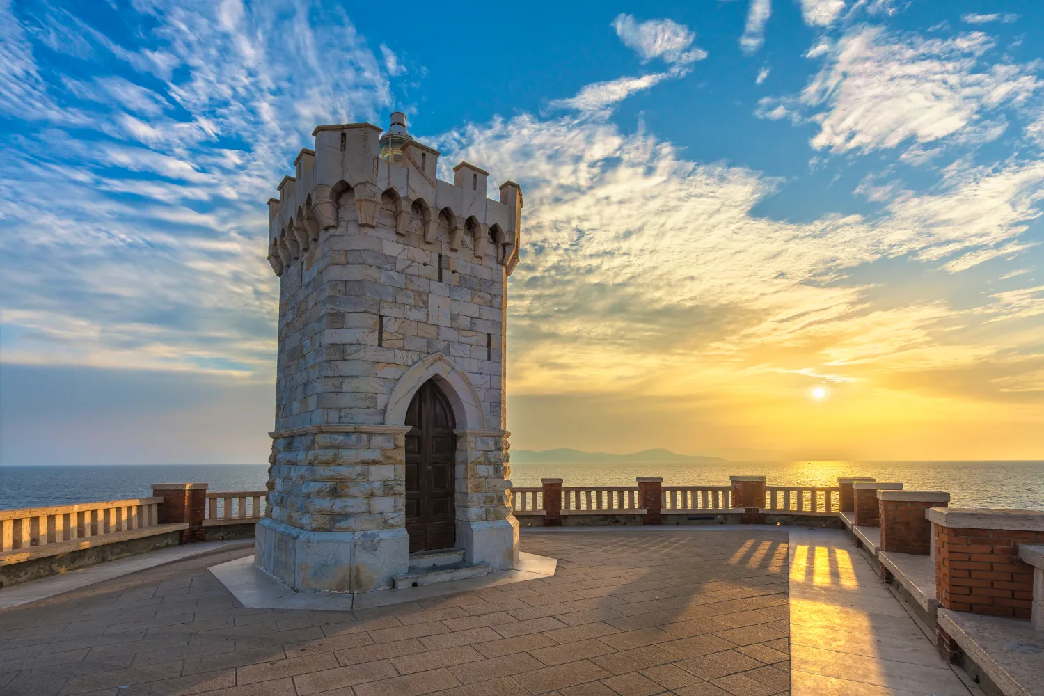 Sunset View Of Piombino Piazza Bovio Lighthouse And Elba Island in the background