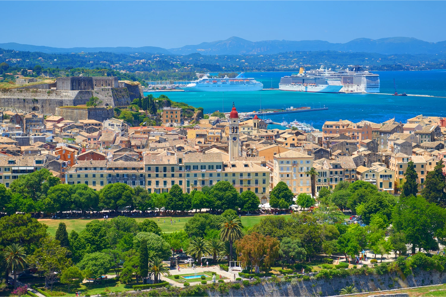 Panoramic view of Corfu Town and port with docked ferry to Corfu