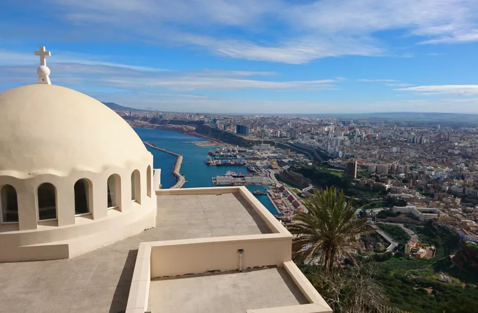 View of a church and the port of Oran in the background