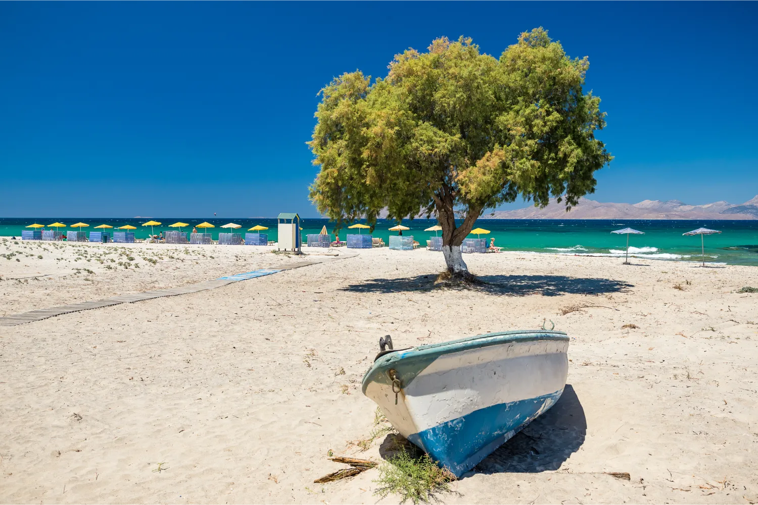 A fishing boat on the sand of Marmari Beach In Mastichari, Kos