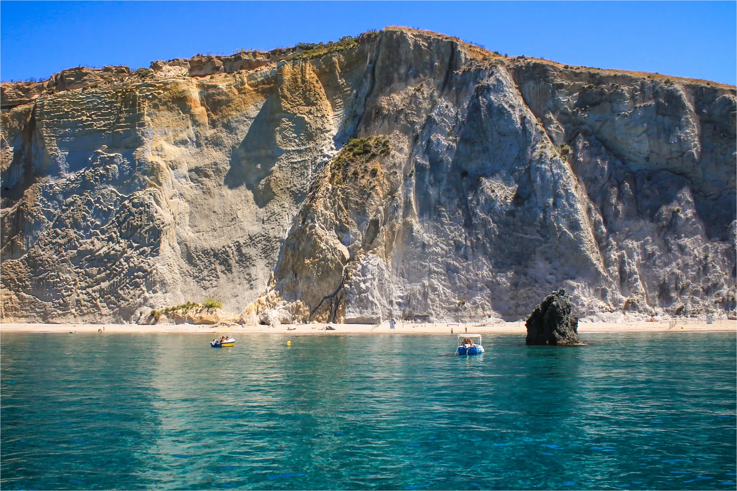 Beautiful Face Of The Ponza Island Seen From The Crystal Clear Blue Water Of Chiaia Di Luna