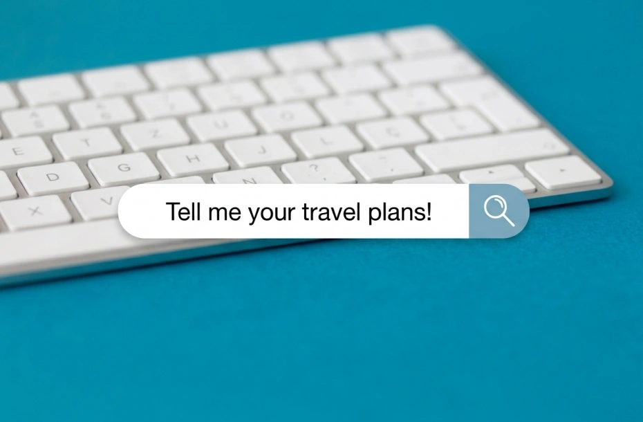 An angled photo of a white keyboard against a bright turquoise-blue background. A digital search box is overlaid in the center, with the text "Tell me your travel plans!" and a button with a magnifying glass icon.