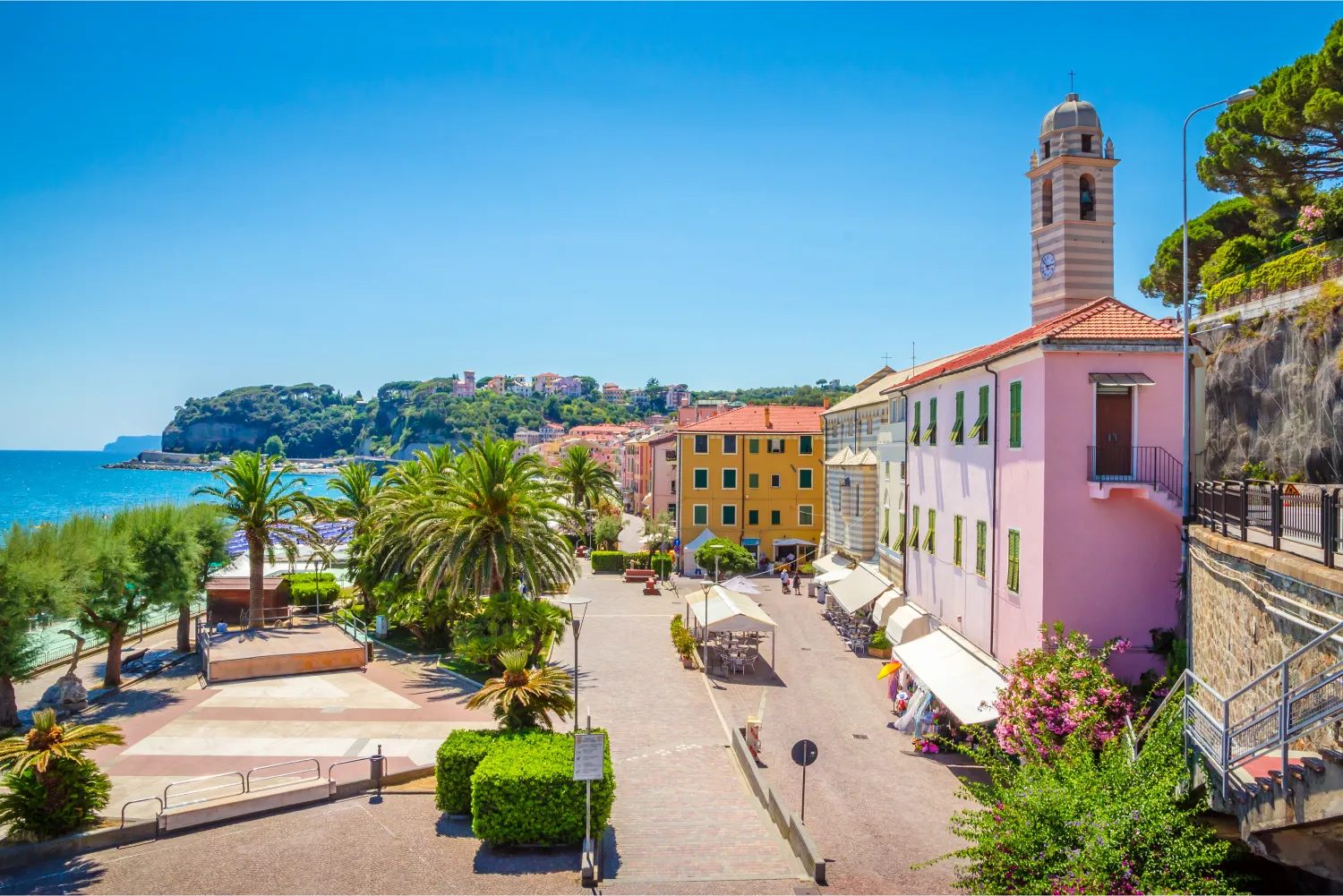 Beautiful Street with trees And Traditional colorful Buildings in Savona