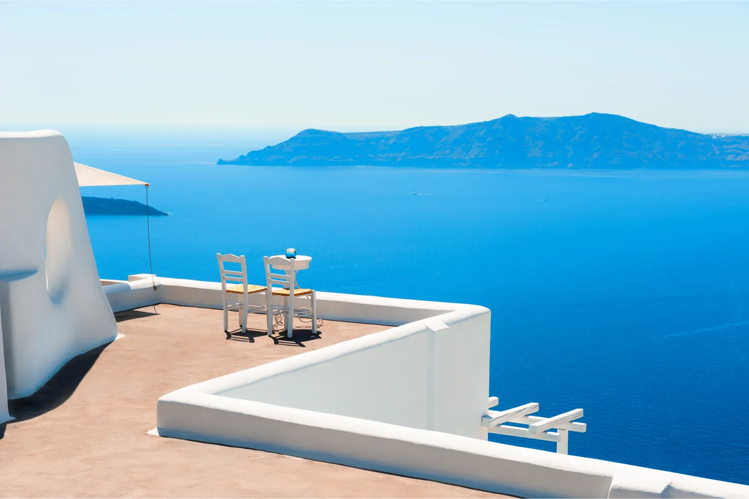 Two Chairs On The Terrace With Caldera View in Santorini