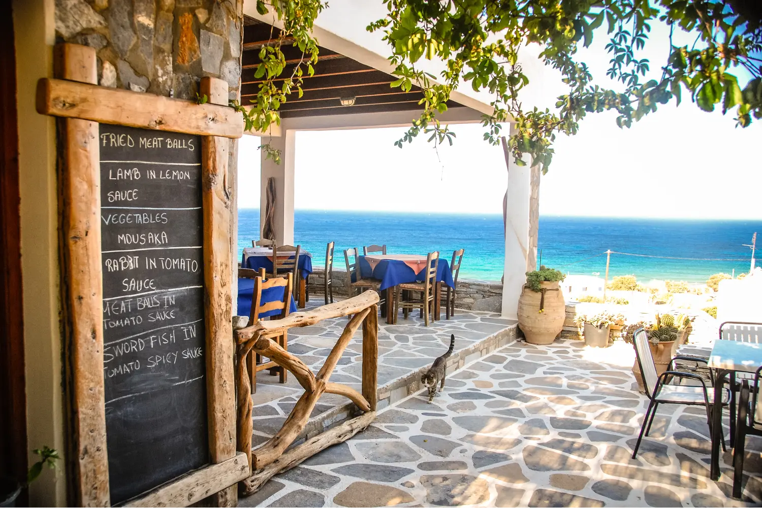 A tavern in Ios, overlooking the blue sea