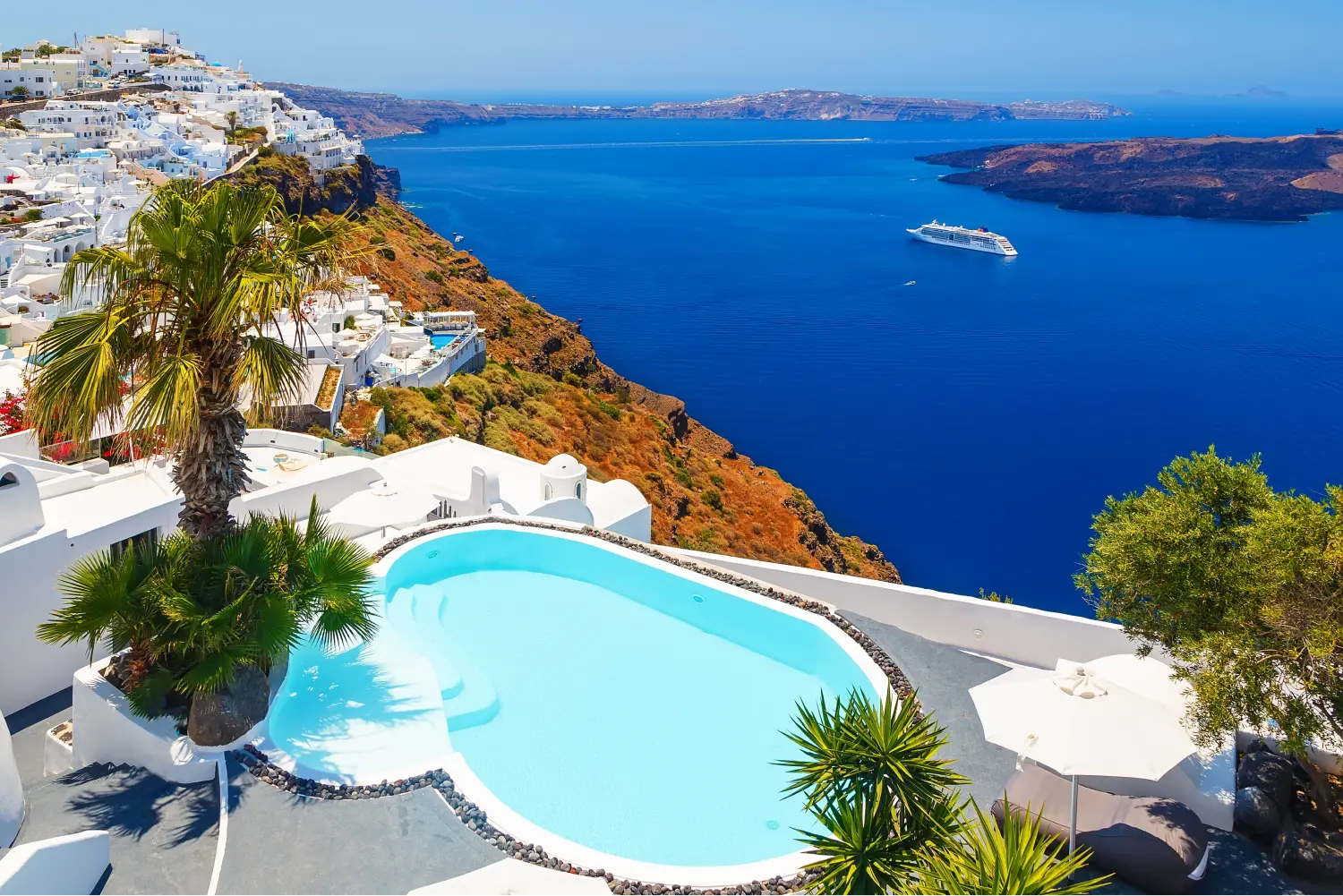 Stunning view of the caldera from a luxurious hotel with pool in Santorini