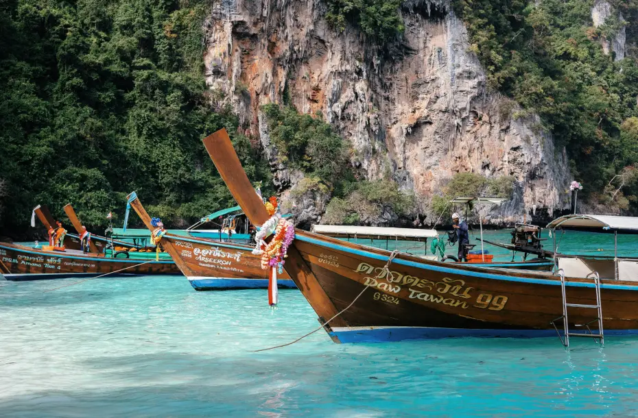 Wooden boats at the beach, waiting to transfer passengers from Rassada Pier in Phuket
