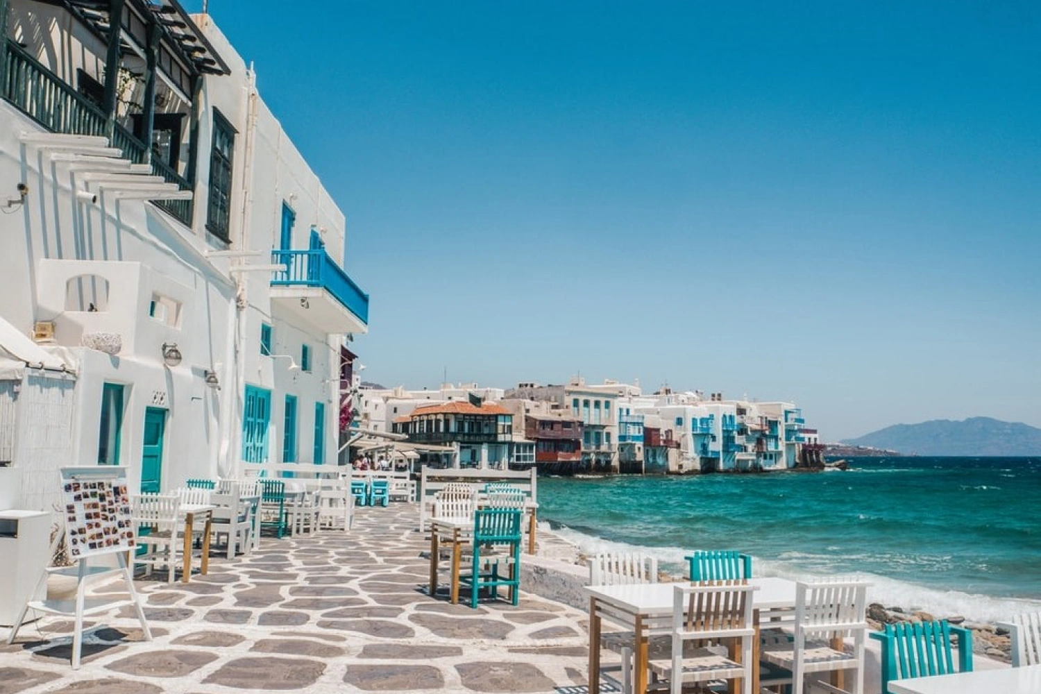 Seaside restaurant in Little Venice, Mykonos. From there, you can see the arriving and departing ferry to Mykonos